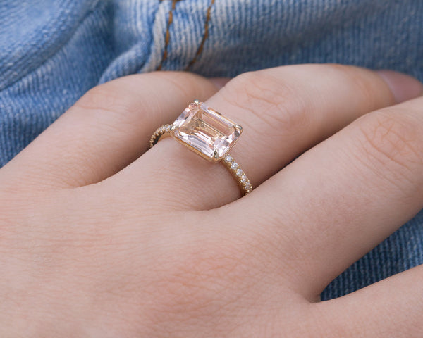 woman wearing east-west morganite engagement ring on hand