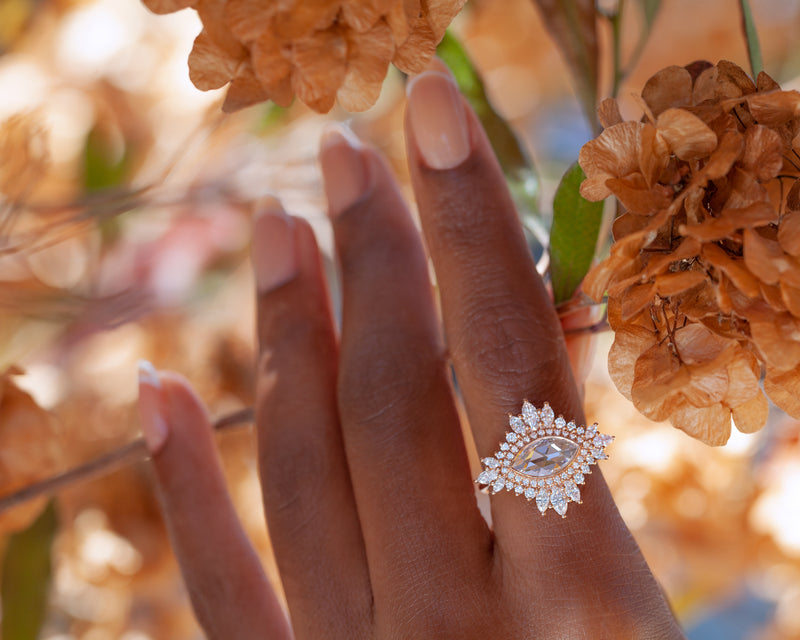marquise diamond cluster ring on finger