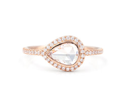 0.60 Carat  east west rose cut pear diamond  in 14k rose gold blair setting with halo and pavé diamonds front