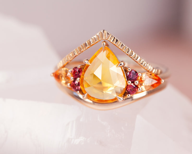 Sunset Sapphire Ring stack on table
