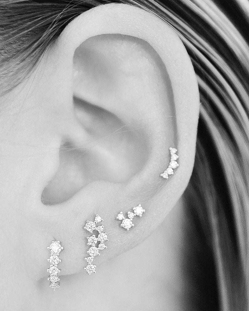 woman wearing henley diamond stud earrings